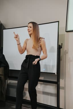 Emma Huschka teaching at a whiteboard